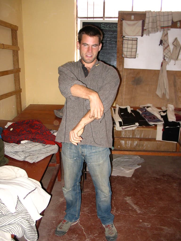 Simon tries on a local jumper